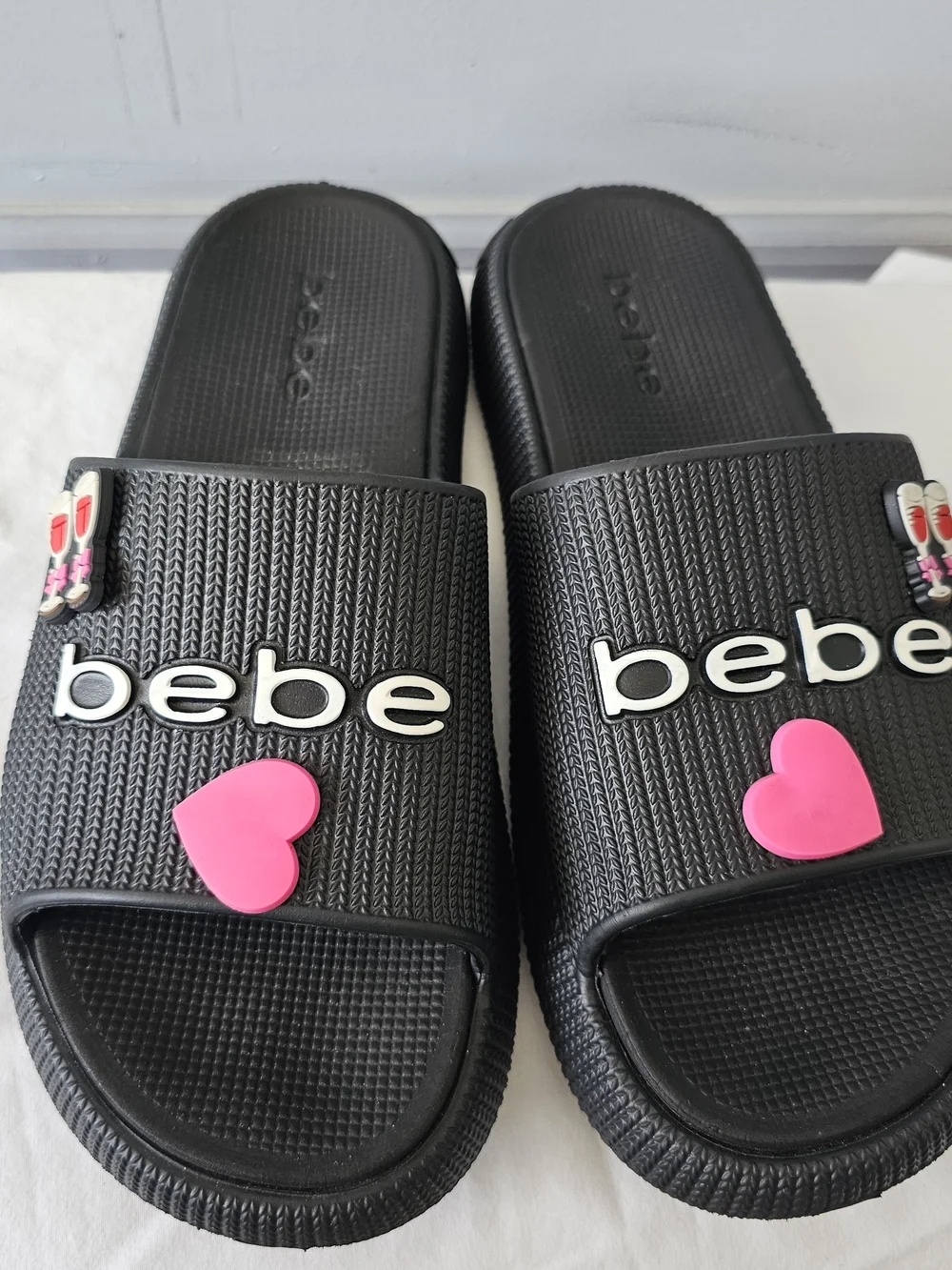 bebe Black Slide Sandals with Pink Heart Accent